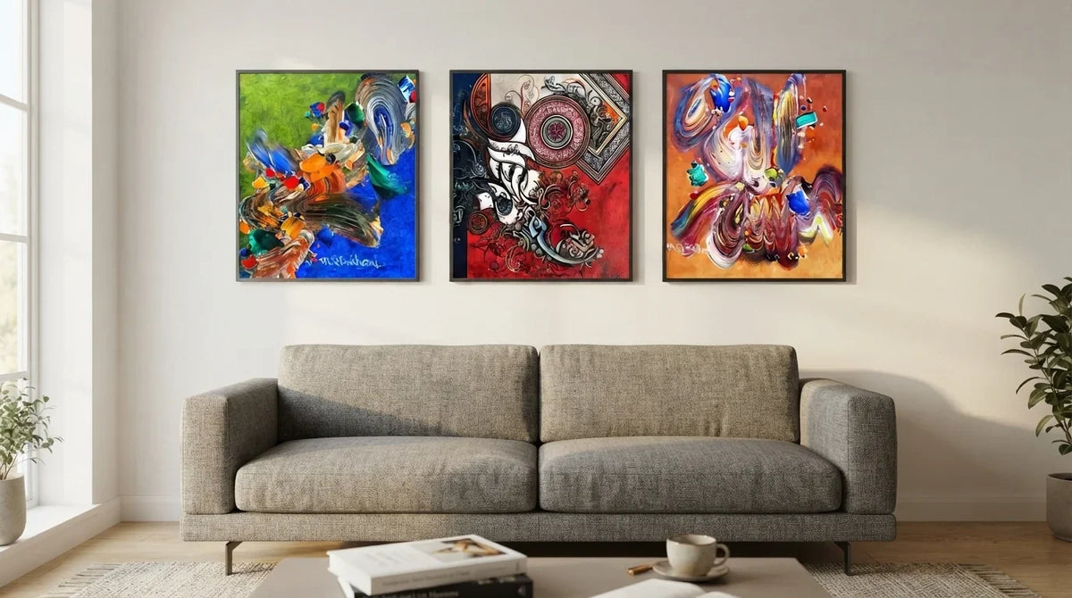 Above a stylish couch, three pieces of abstract Arabic calligraphy art create a striking focal point in the room.