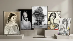 Artwork consisting of charcoal paintings arranged on a white wall, creating a striking visual impact in the room.