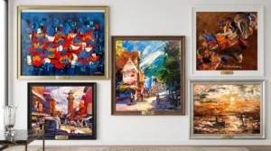Various abstract wall art frames arranged on a wall, featuring bold colors and dynamic forms.